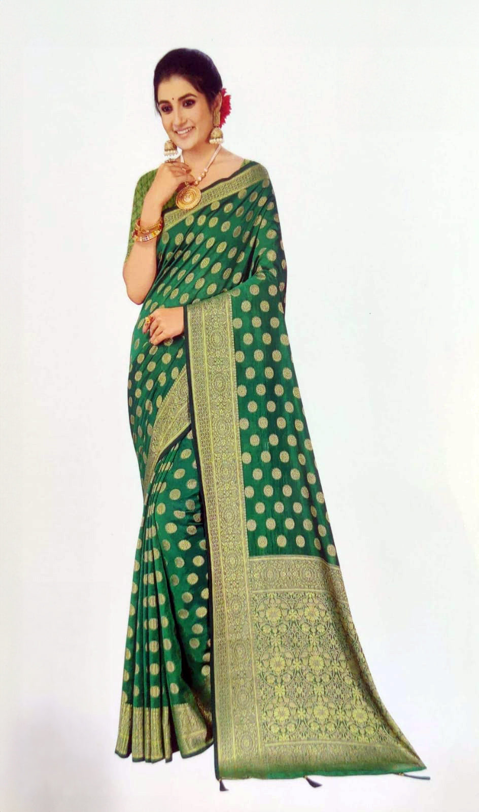 Deep green saree with a contrasting gold border