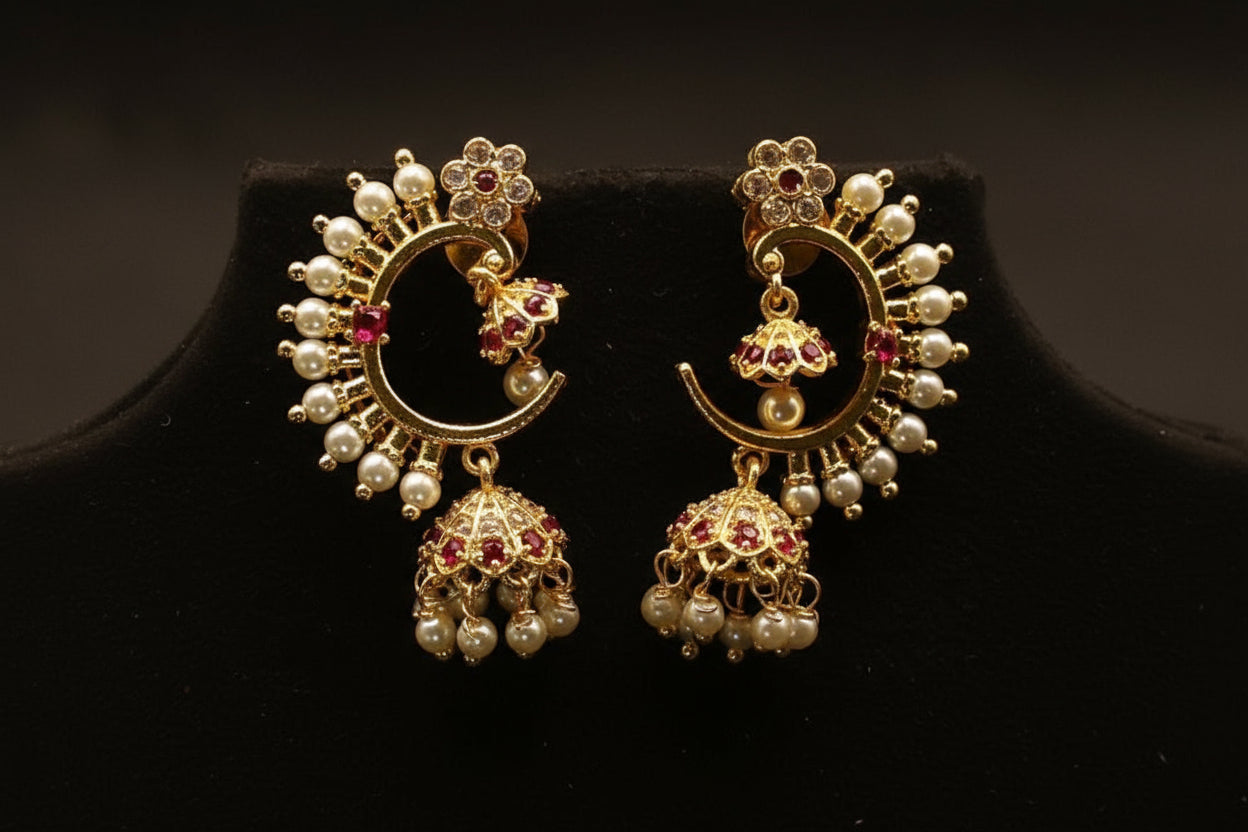 Gold-toned Chandbali Jhumka earrings with pearls and ruby stones.