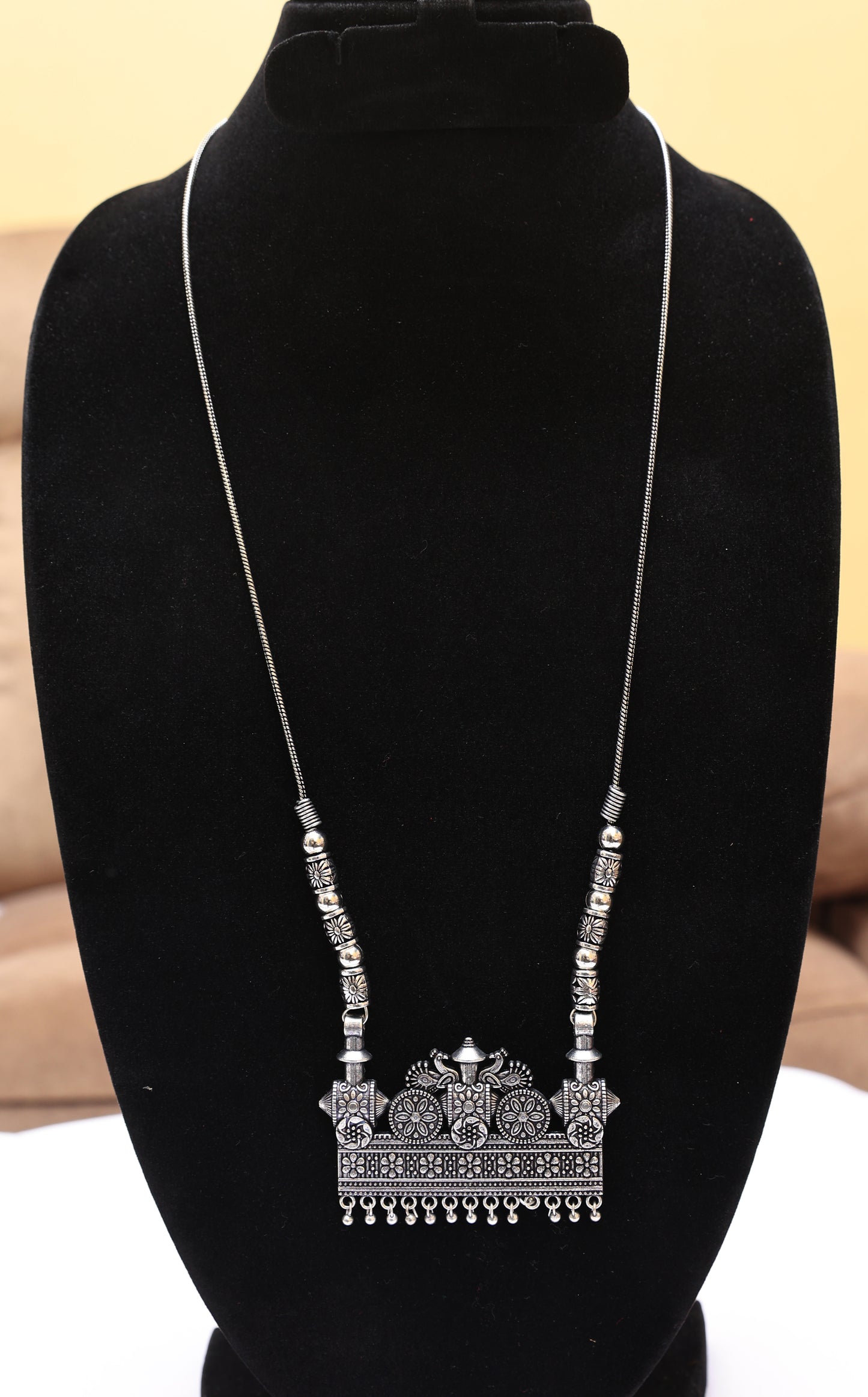 Luminous Ethnic Silver Toned Necklace