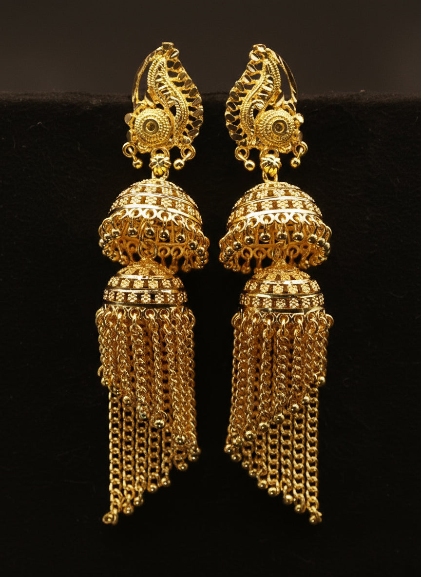 Pair of gold earrings with intricate designs 