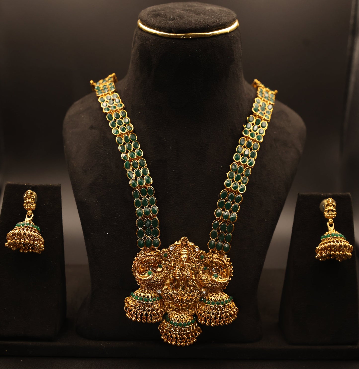 gold plated necklace set with green emerald