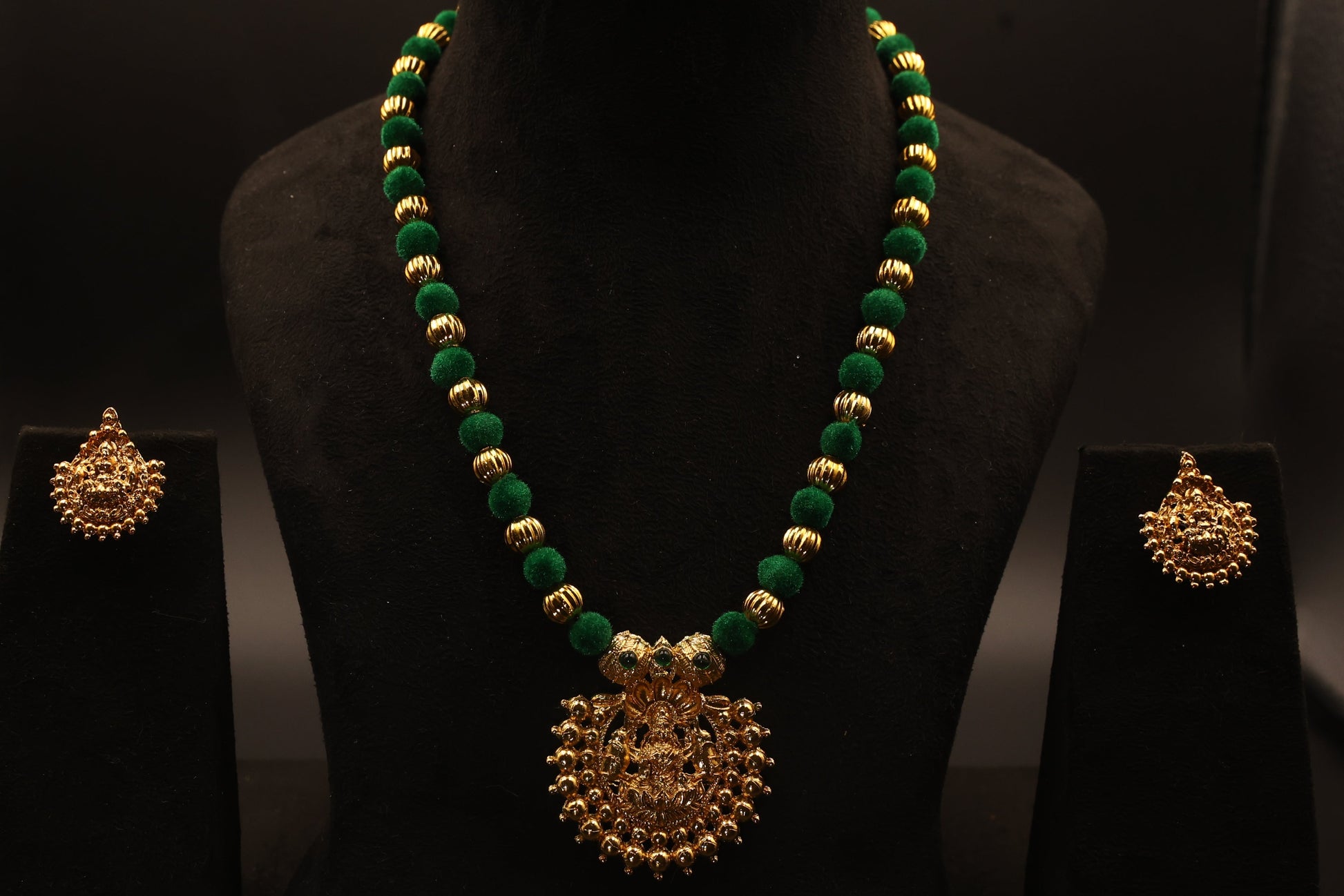 long necklace with green and golden beads